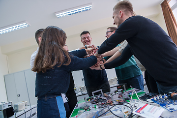 Image showing students celebrating successfully finished project