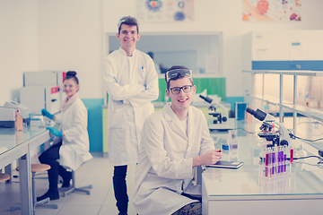 Image showing Group of young medical students doing research