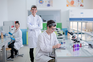 Image showing Group of young medical students doing research