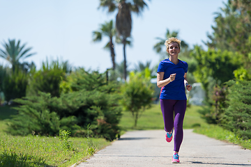 Image showing young female runner training for marathon