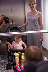 Image showing happy family in the elevator