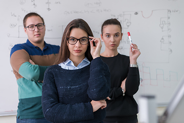 Image showing portrait of young students in front of chalkboard