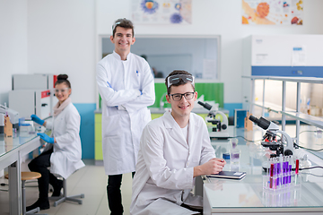 Image showing Group of young medical students doing research