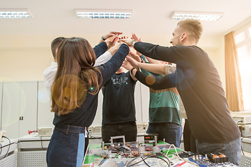 Image showing students celebrating successfully finished project