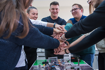 Image showing students celebrating successfully finished project