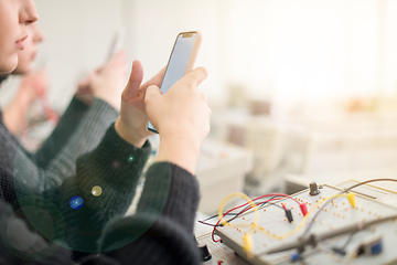 Image showing female student using a mobile phone