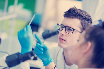 Image showing Group of young medical students doing research