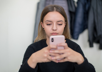 Image showing female student using a mobile phone