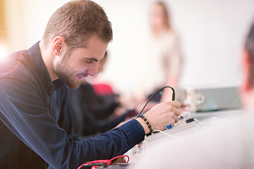 Image showing students doing practice in the electronic classroom