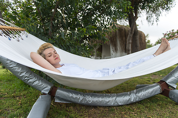 Image showing young woman resting on hammock