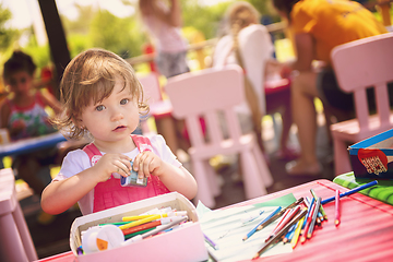 Image showing little girl drawing a colorful pictures