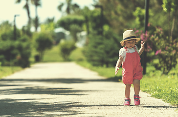 Image showing little girl runing in the summer Park