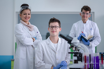 Image showing Group of young medical students doing research