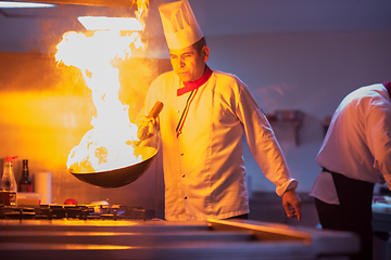 Image showing Chef doing flambe on food