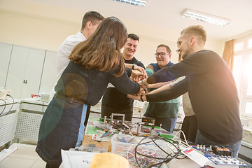 Image showing students celebrating successfully finished project