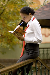 Image showing businesswoman with notebook outside