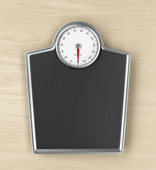 Image showing Weighing scale on wooden floor