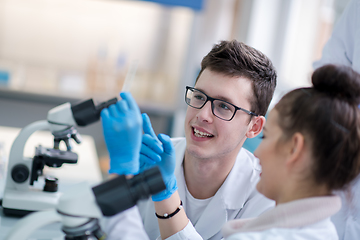 Image showing Group of young medical students doing research