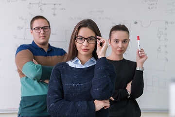 Image showing portrait of young students in front of chalkboard