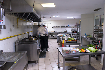 Image showing team cooks and chefs preparing meals