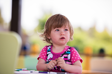 Image showing little girl drawing a colorful pictures