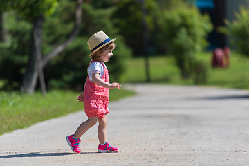 Image showing little girl runing in the summer Park