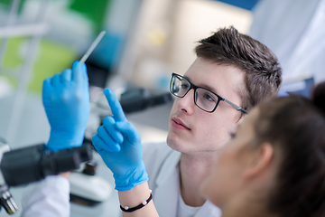 Image showing Group of young medical students doing research