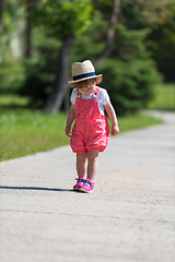 Image showing little girl runing in the summer Park