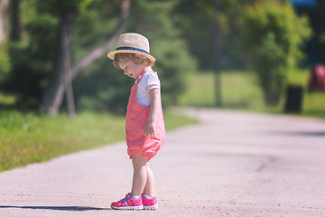 Image showing little girl runing in the summer Park