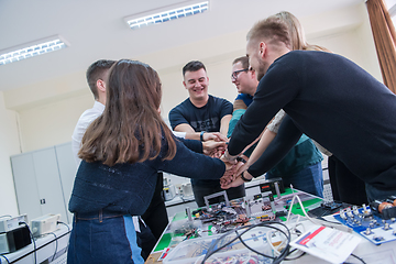 Image showing students celebrating successfully finished project