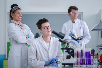 Image showing Group of young medical students doing research