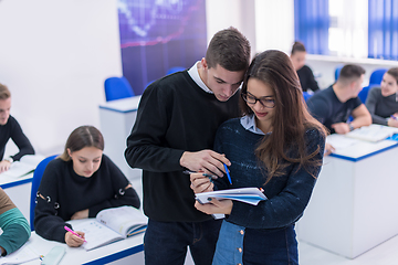 Image showing young students writing notes