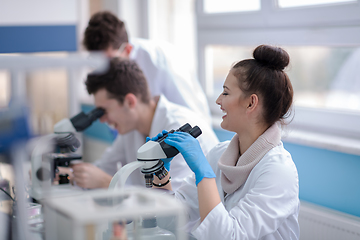 Image showing Group of young medical students doing research