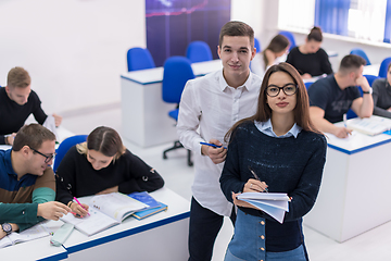 Image showing young students writing notes