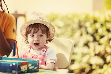 Image showing little girl drawing a colorful pictures