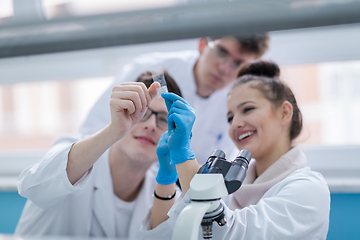 Image showing Group of young medical students doing research