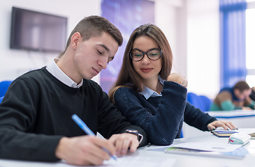 Image showing young students writing notes