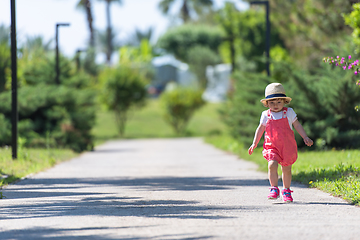 Image showing little girl runing in the summer Park