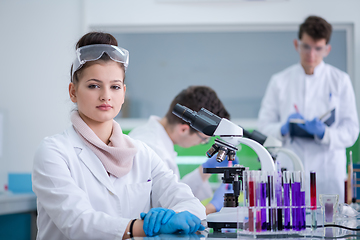 Image showing Group of young medical students doing research