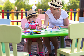 Image showing mom and little daughter drawing a colorful pictures