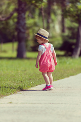 Image showing little girl runing in the summer Park