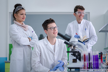 Image showing Group of young medical students doing research