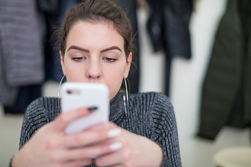 Image showing female student using a mobile phone