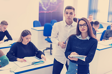 Image showing young students writing notes