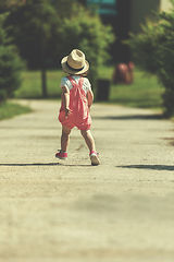 Image showing little girl runing in the summer Park