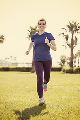 Image showing young female runner training for marathon