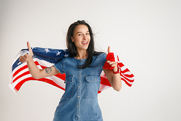 Image showing Young woman with the flag of United States of America