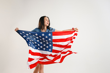 Image showing Young woman with the flag of United States of America