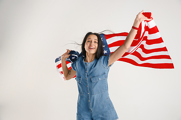 Image showing Young woman with the flag of United States of America