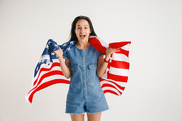 Image showing Young woman with the flag of United States of America